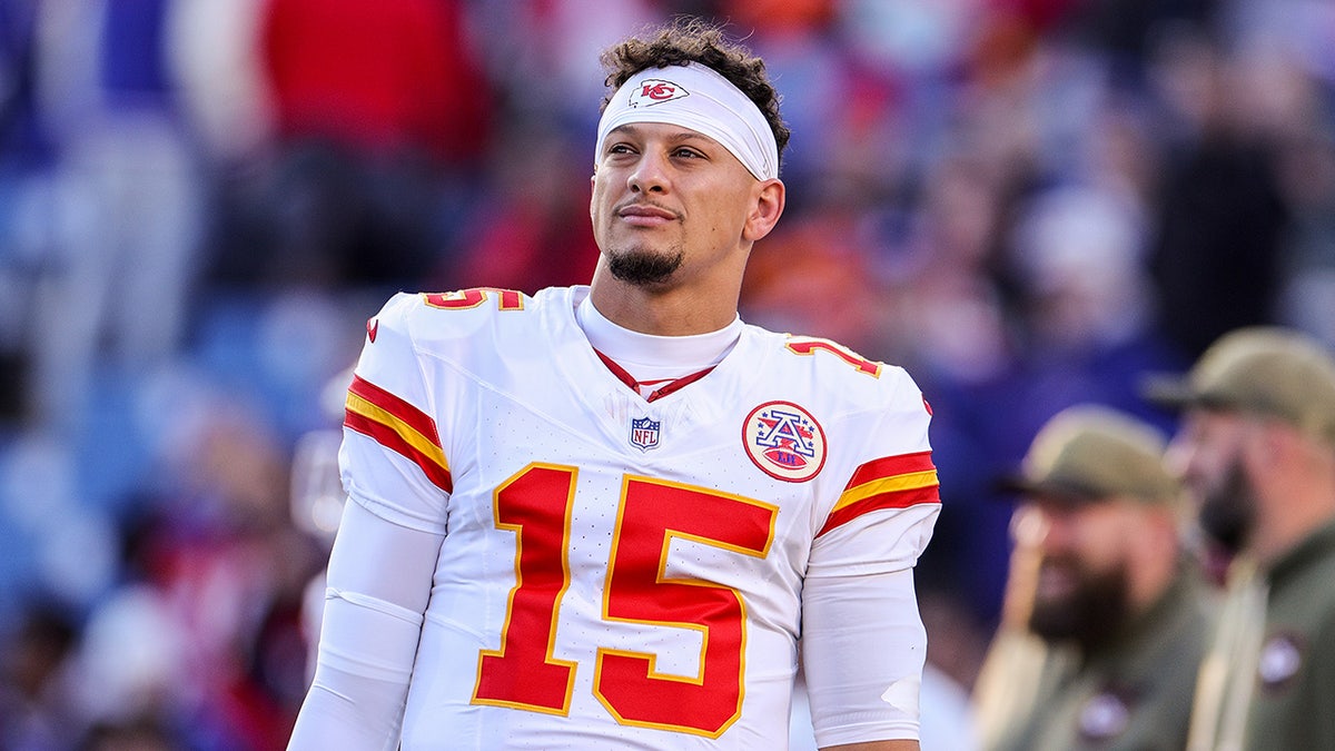 Patrick Mahomes looks on before a game