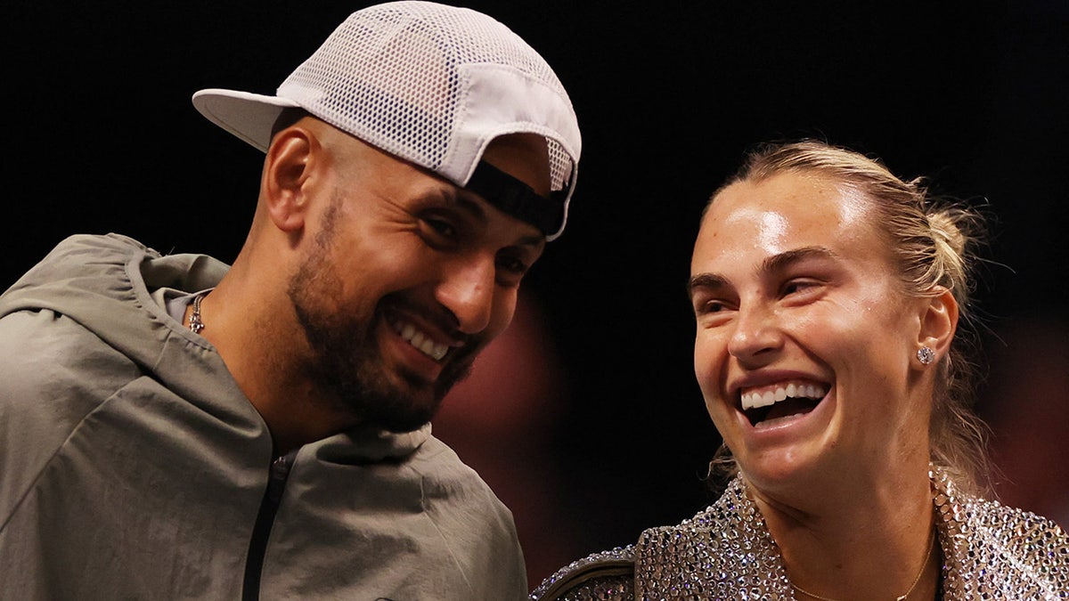 Aryna Sabalenka and Nick Kyrgios laugh before their match
