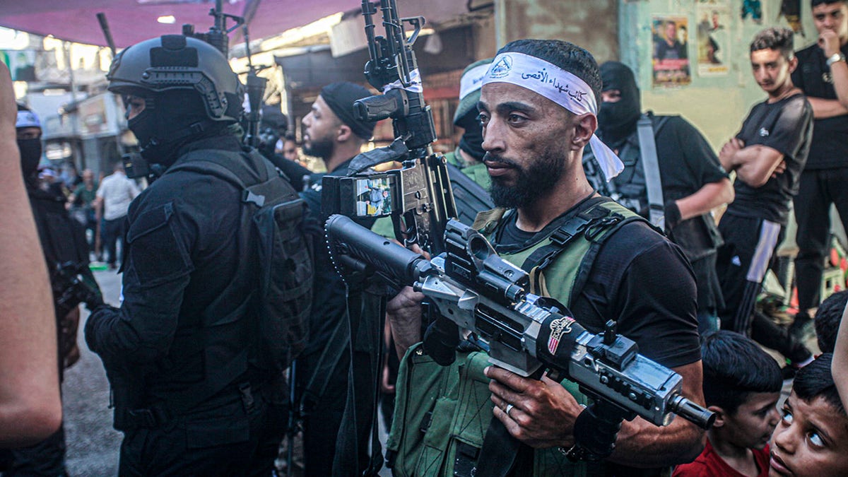 Terrorist carrying weapon