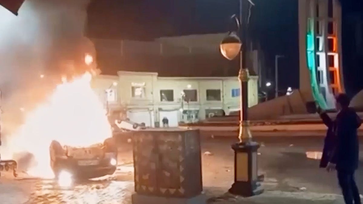 Car on fire in Tehran.