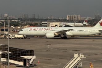 Passengers baffled and confused after screams burst from beneath taxiing Air Canada plane