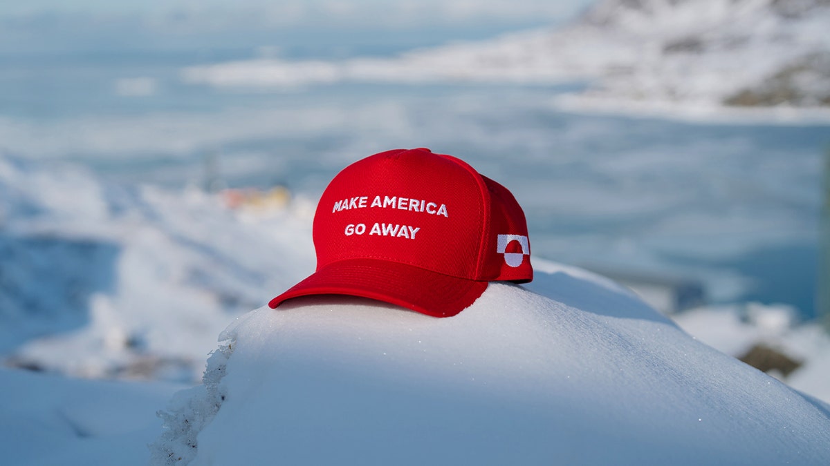 A slogan baseball cap displayed in a Greenland town reflects opposition to U.S. influence