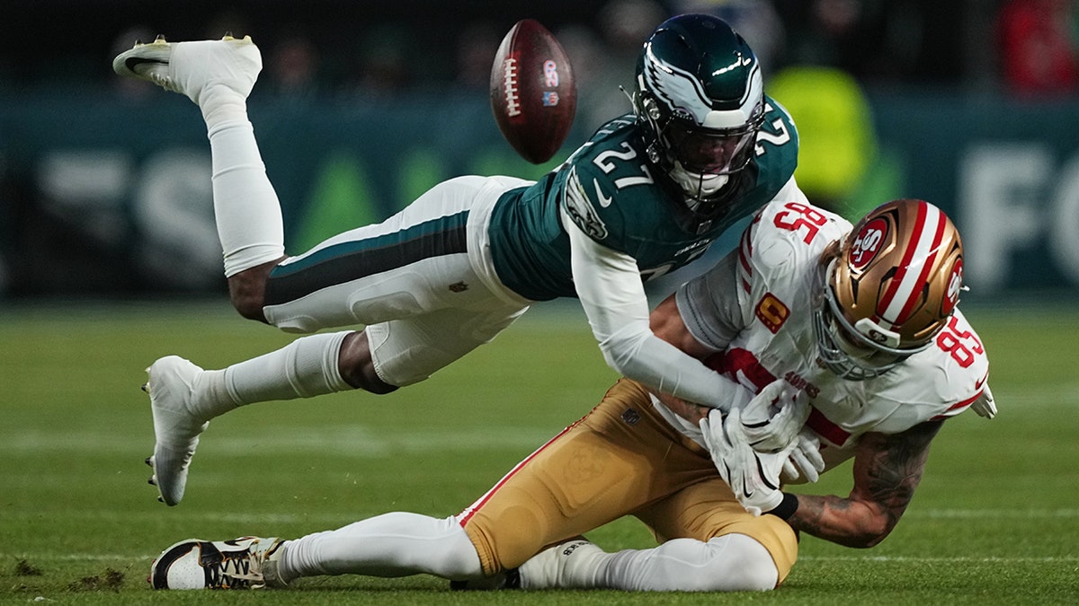 George Kittle is defended