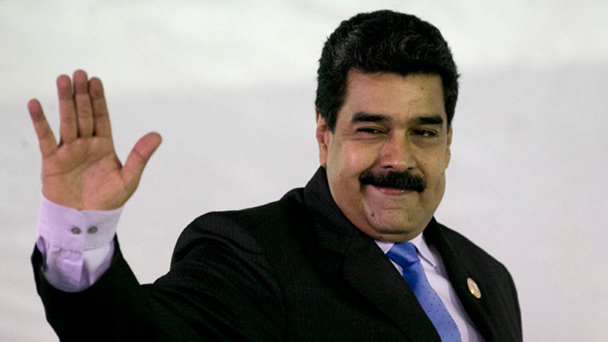 FILE - In this Sept 18, 2016, file photo, Venezuela's President Nicolas Maduro gestures as he arrives for a press conference after closing ceremony of the 17th Non-Aligned Movement Summit in Porlamar, on Venezuela's Margarita Island. Venezuelan election officials have quashed on Wednesday, Sept. 21, the opposition's hope of holding a recall referendum that could wrest the presidency from Maduro. (AP Photo/Ariana Cubillos, File)