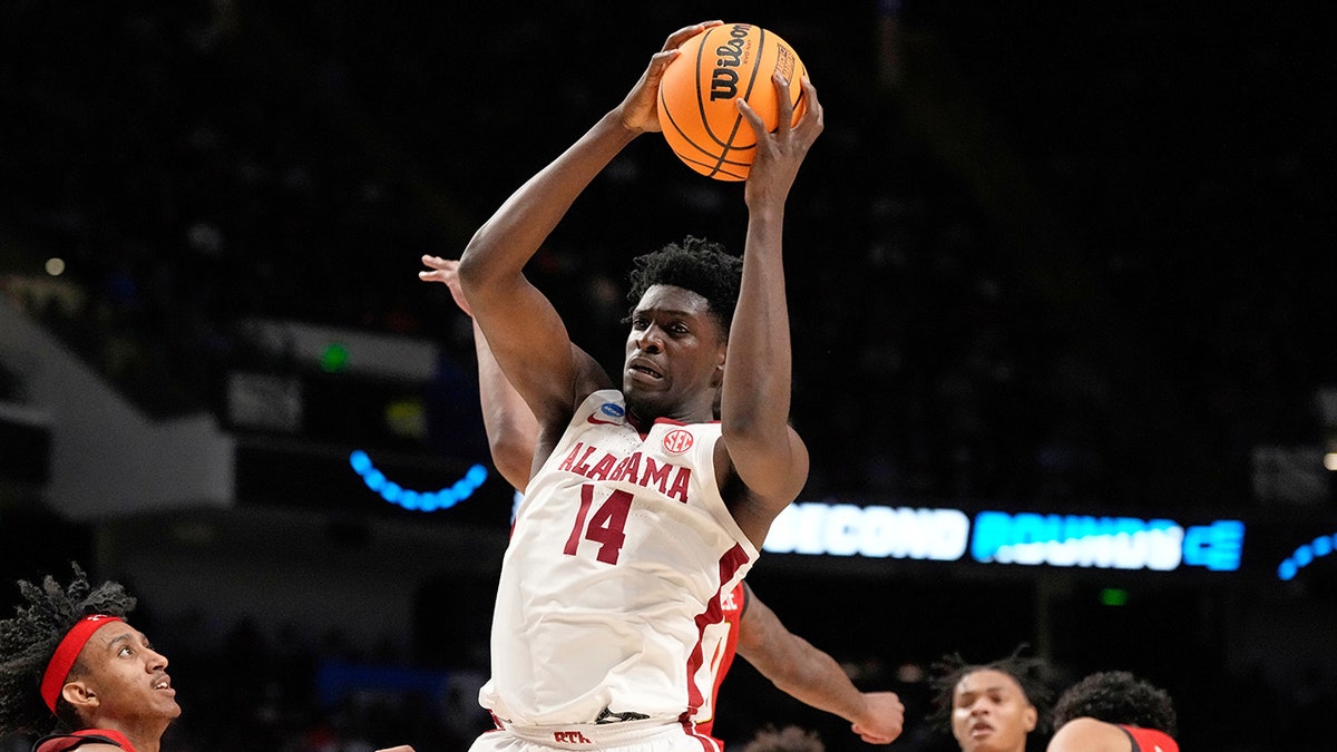 Charles Bediako looks on