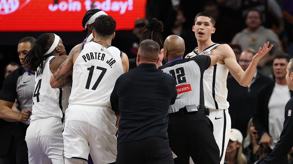 Egor Demin reacts during a scuffle