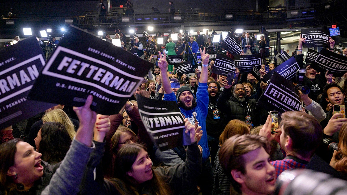 John Fetterman supporters react at watch party during 2022 midterms