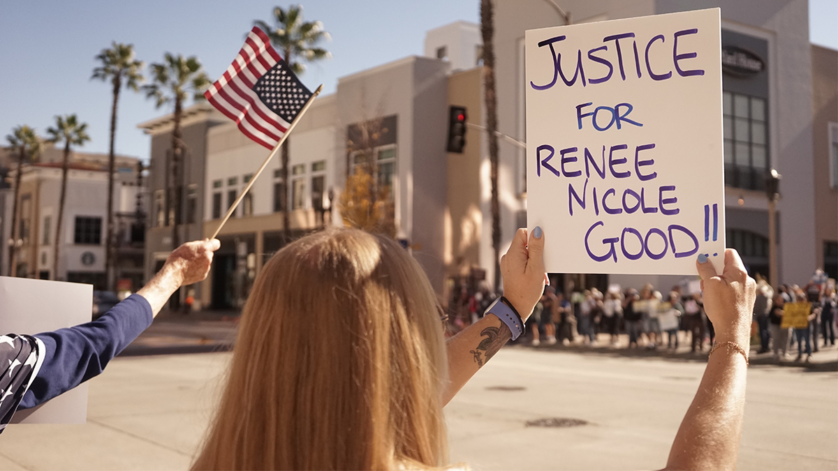 Nicole Good supporter holding a sign
