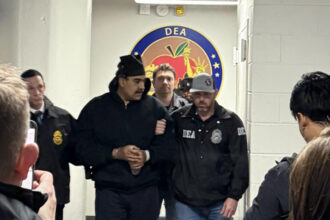 Solemn-faced Nicolás Maduro sports handcuffs as he makes first public comment since capture during perp walk