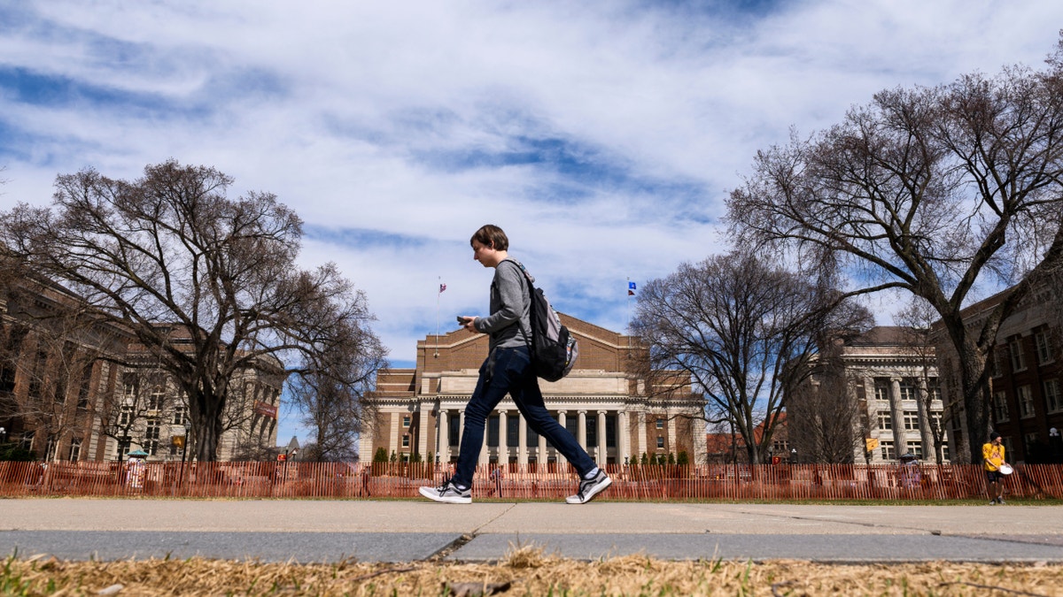 Student walking at the University of Minnesota