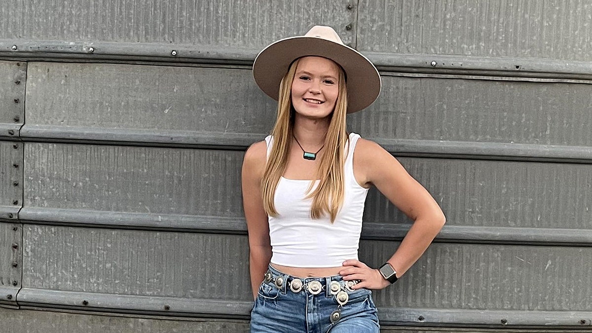 Rachel McCarty smiling while wearing a hat.