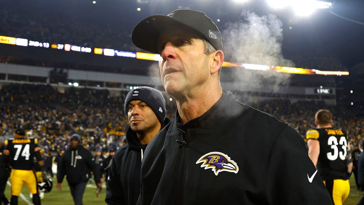 John Harbaugh walks off field