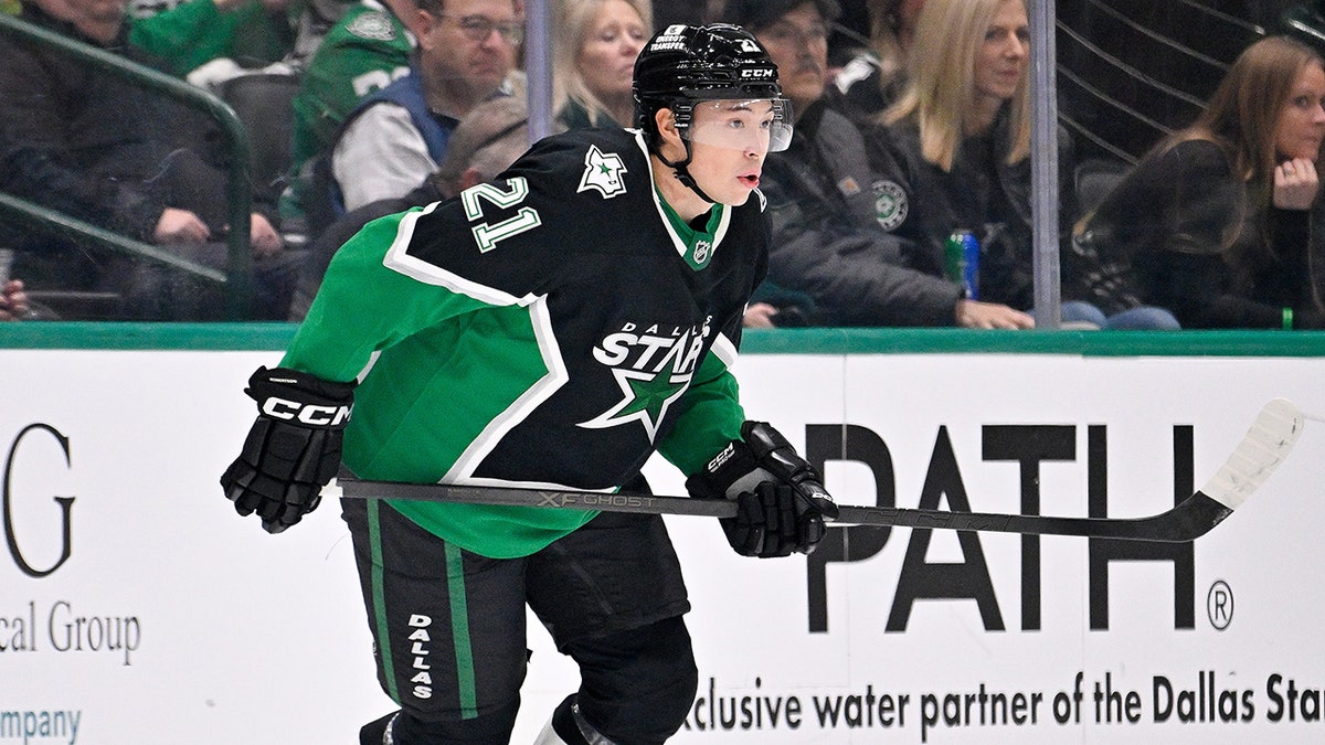 Jason Robertson looks on