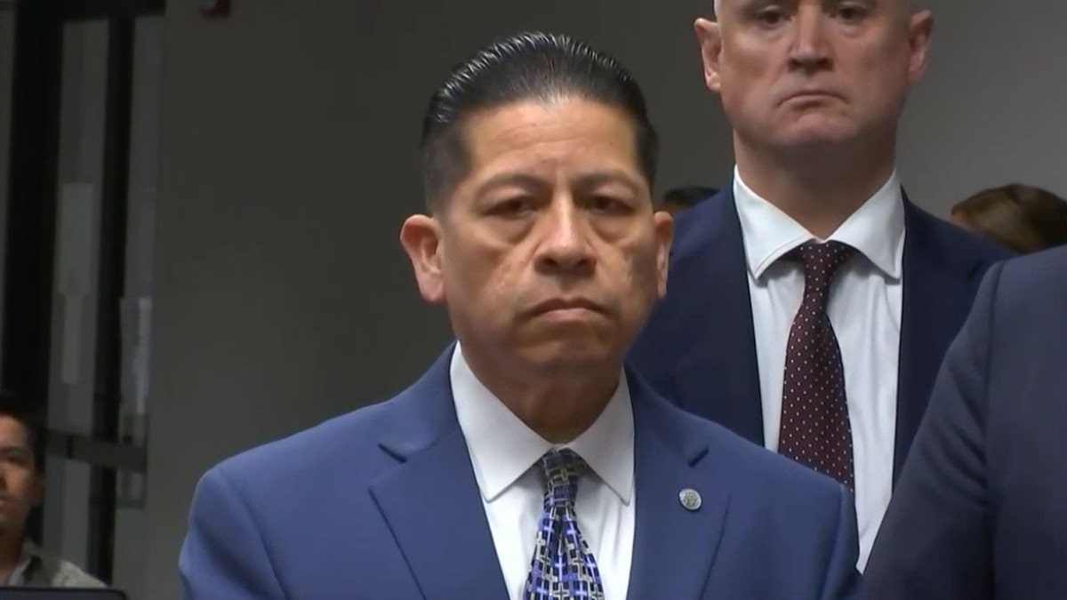 Adrian Gonzales listening to the verdict.