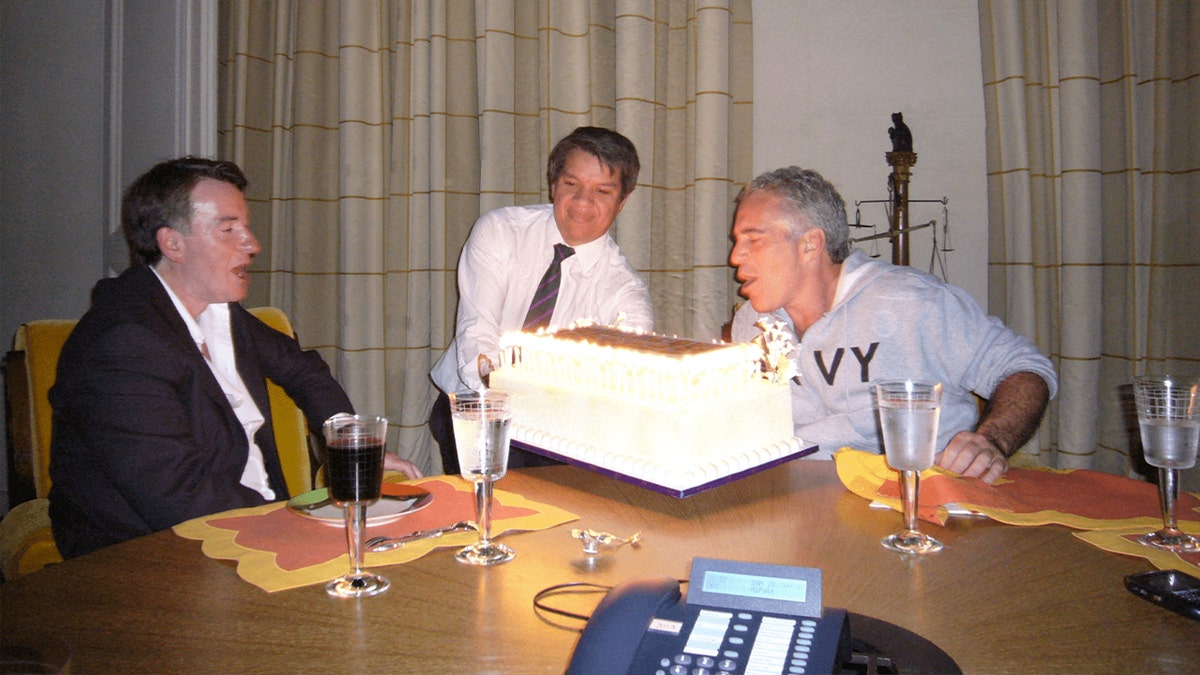 Peter Mandelson at a table with Jeffrey Epstein
