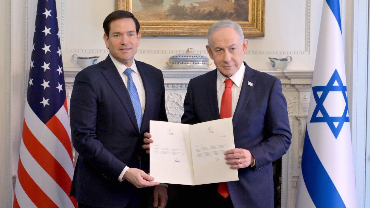 Marco Rubio and Benjamin Netanyahu display a signed document after concluding talks in Washington.