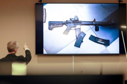 Georgia father on trial, accused of giving son rifle before school shooting