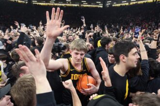 Court storm turns hectic as coach smacks fan’s phone; school apologizes for forcing ‘reactive situation’