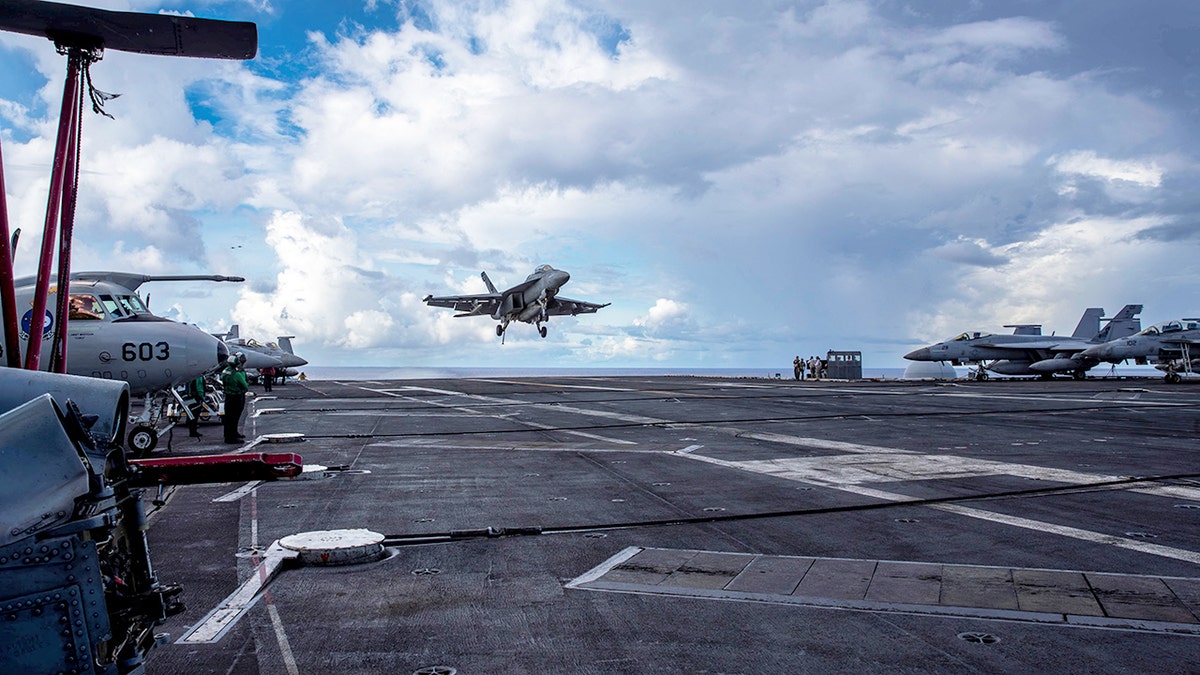 F/A-18F Super Hornet lands on flight deck of USS Abraham Lincoln