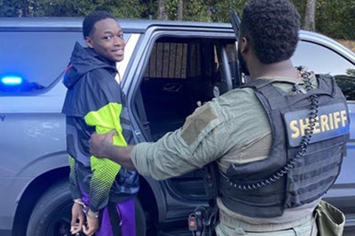 Smirking Georgia teen killer sentenced to life in prison for murdering boy, 14, outside football game