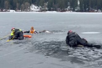 Washington man falls through ice into frigid lake — right in front of cops practicing water rescues