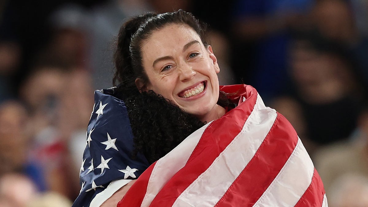 Breanna Stewart draped in American flag