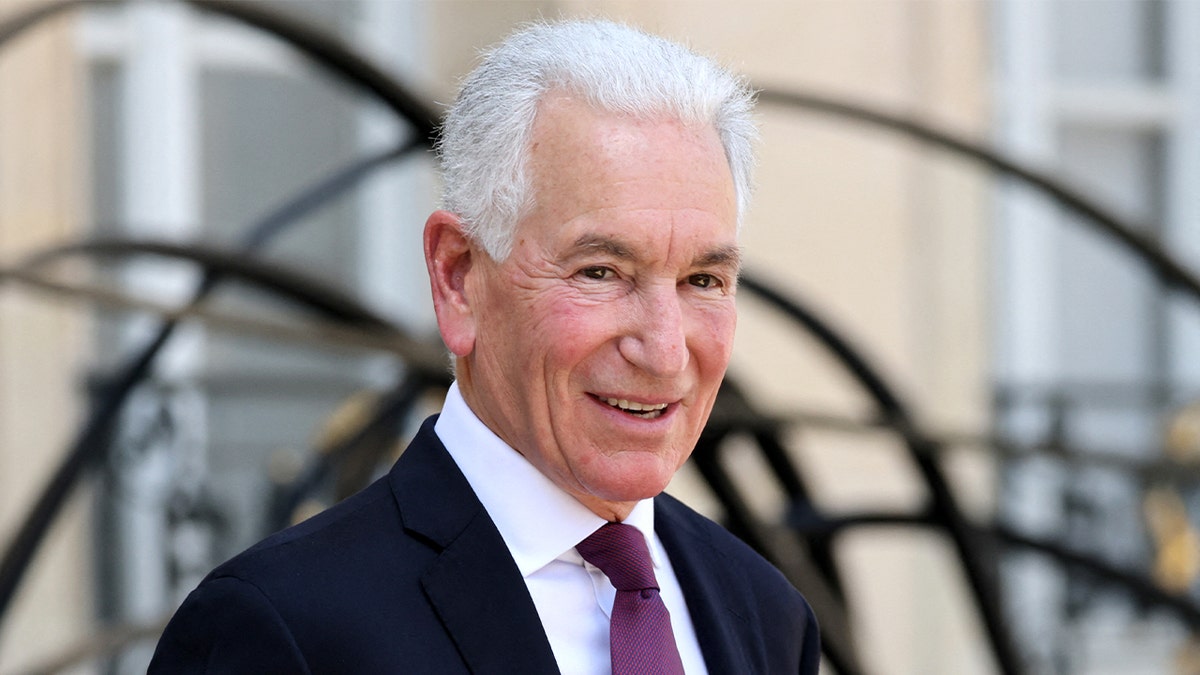 Charles Kushner exits the Elysee Palace in Paris following a meeting with the French president.