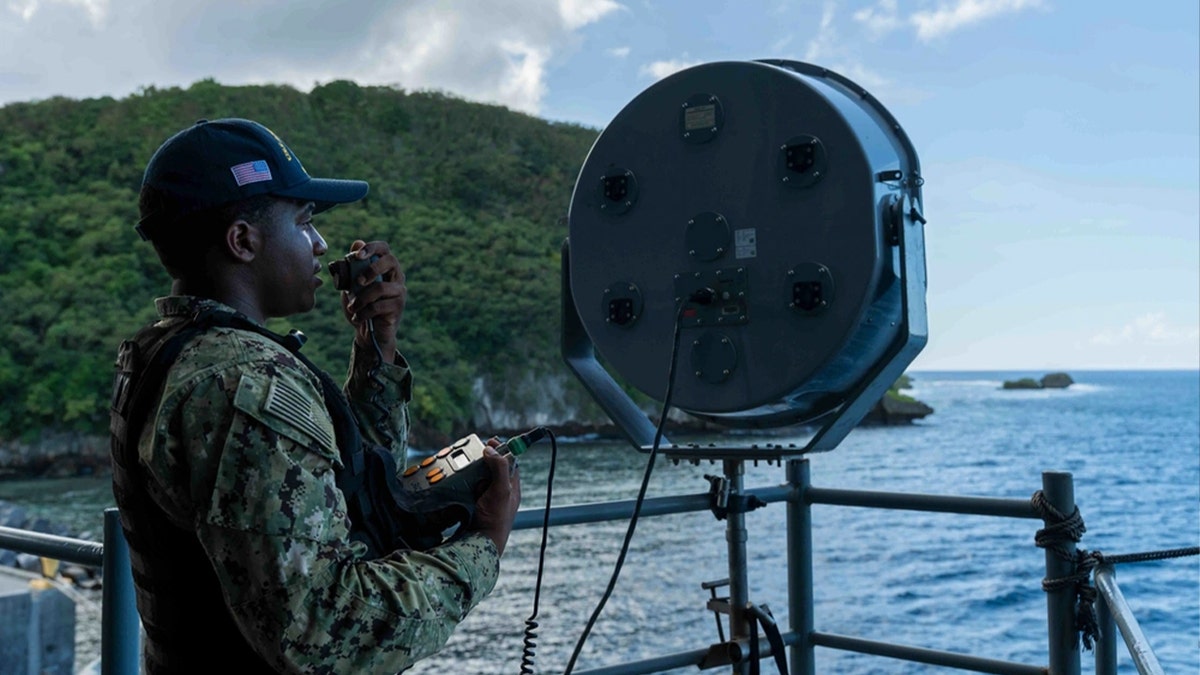 U.S. Navy Aviation Boatswain’s Mate Airman Apprentice Zahir Barrett tests Long Range Acoustic Device (LRAD) on the fantail of Nimitz-class aircraft carrier USS Abraham Lincoln (CVN 72) on Dec. 12, 2025.
