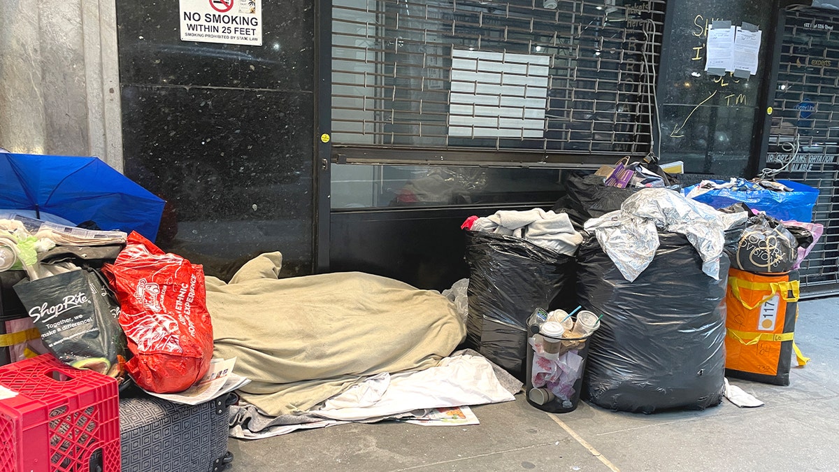 homeless person sleeping in street