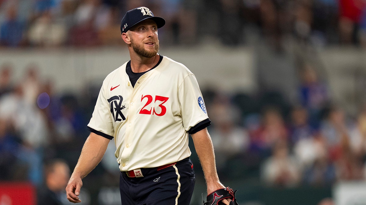 Merrill Kelly looks on 