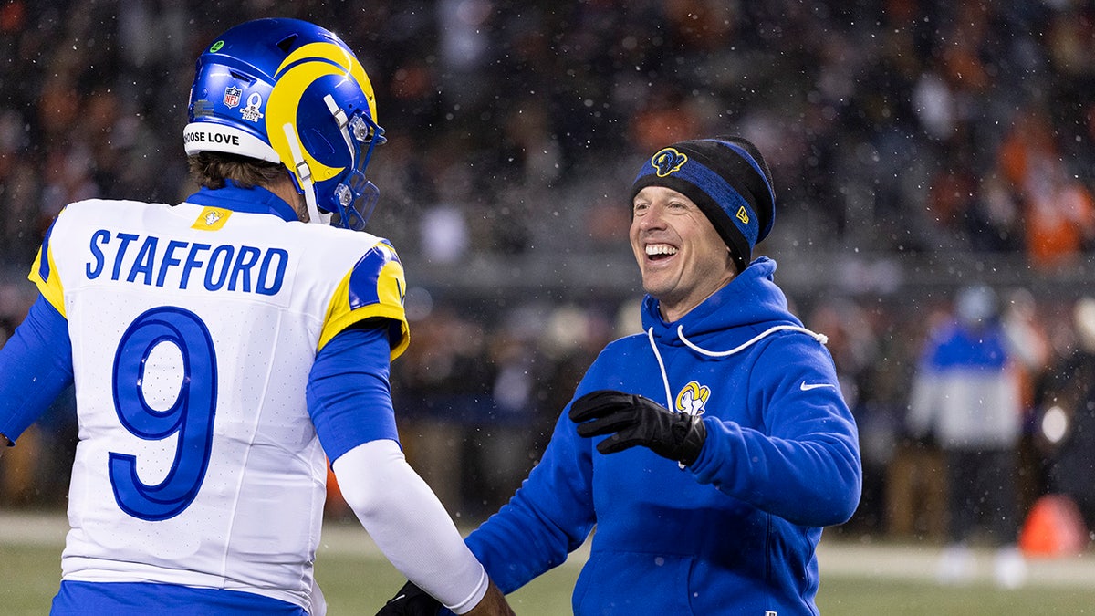 Mike LaFleur celebrates with Matthew Stafford