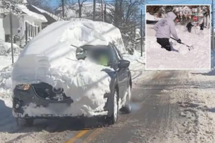 Rhode Island driver blasted for cruising around with mountain of snow on top of SUV after historic blizzard
