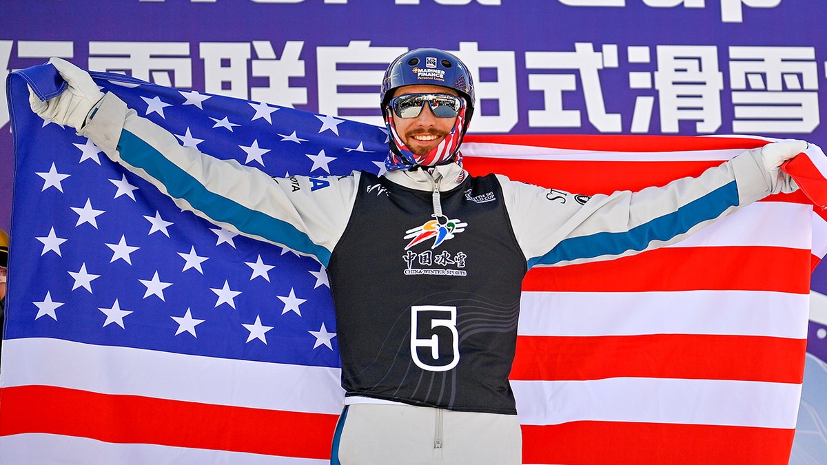 Christopher Lillis poses on the podium
