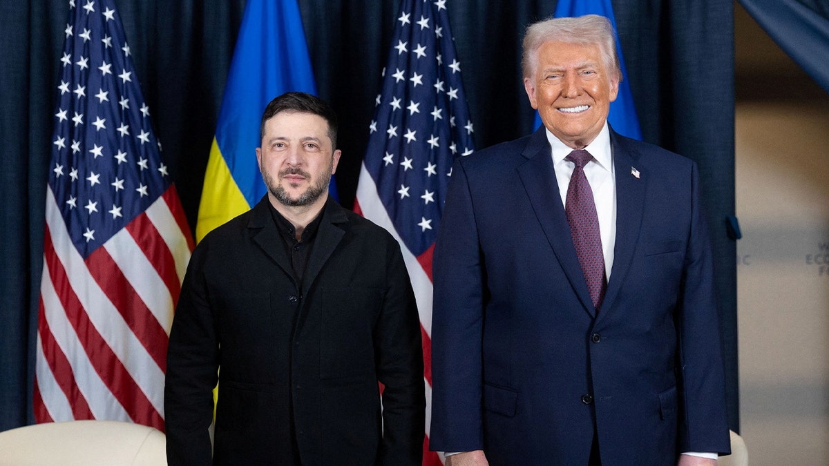 Ukraine's President Volodymyr Zelenskiy and U.S. President Donald Trump pose for a photo during their meeting at the sidelines of the 56th annual World Economic Forum (WEF) in Davos, Switzerland, January 22, 2026.