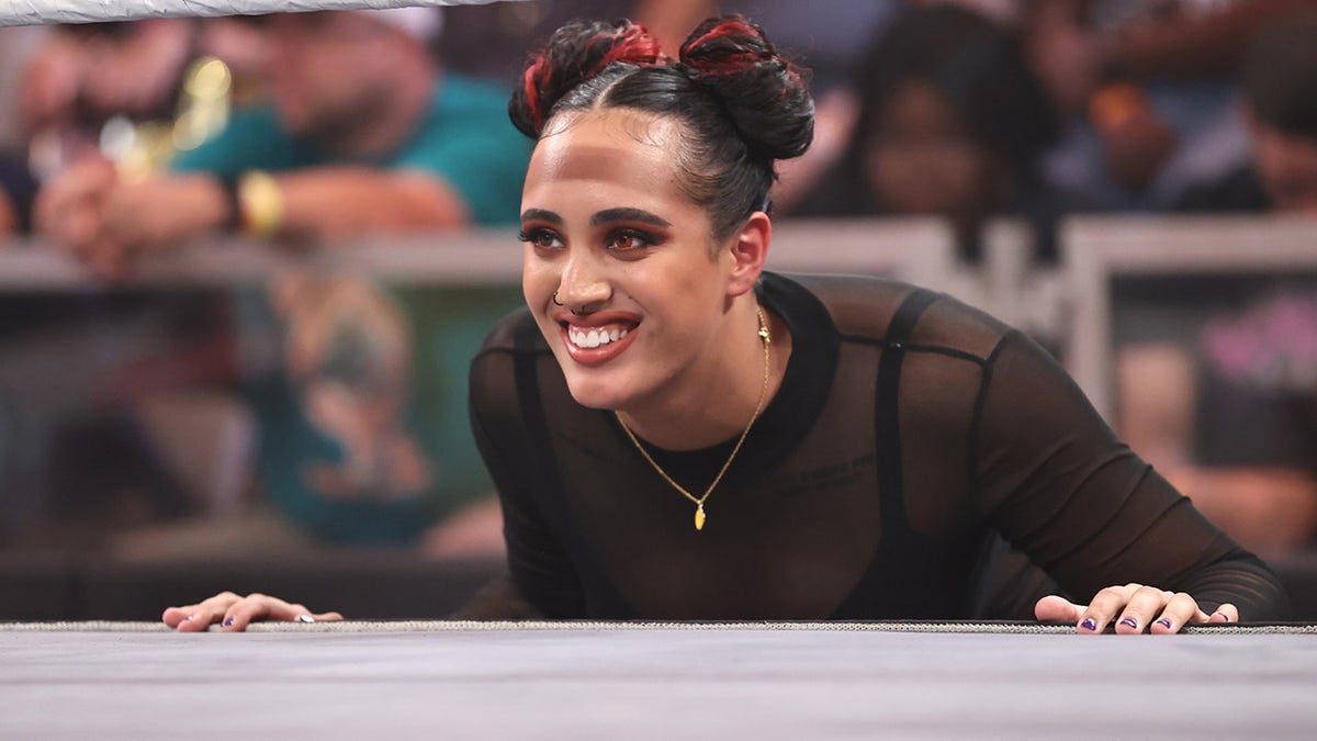 Ava looks on ringside