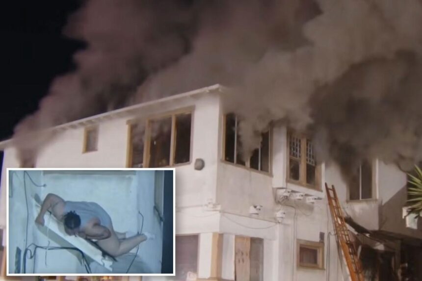 Terrifying moment woman jumps from 2nd-floor window as building erupts in flames