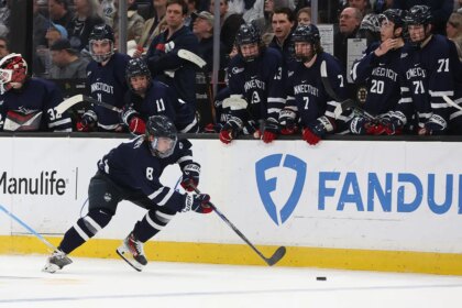 College hockey game thrown into chaos as lights turn off in arena during pivotal moment of OT