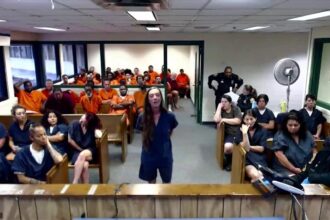 Woman accused of fatal hit-and-run that killed 8-year-old laughs during first court appearance