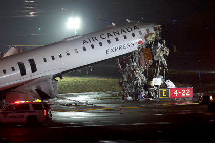 Air Canada jet hits fire truck, killing 2 and forcing New York’s LaGuardia airport to close