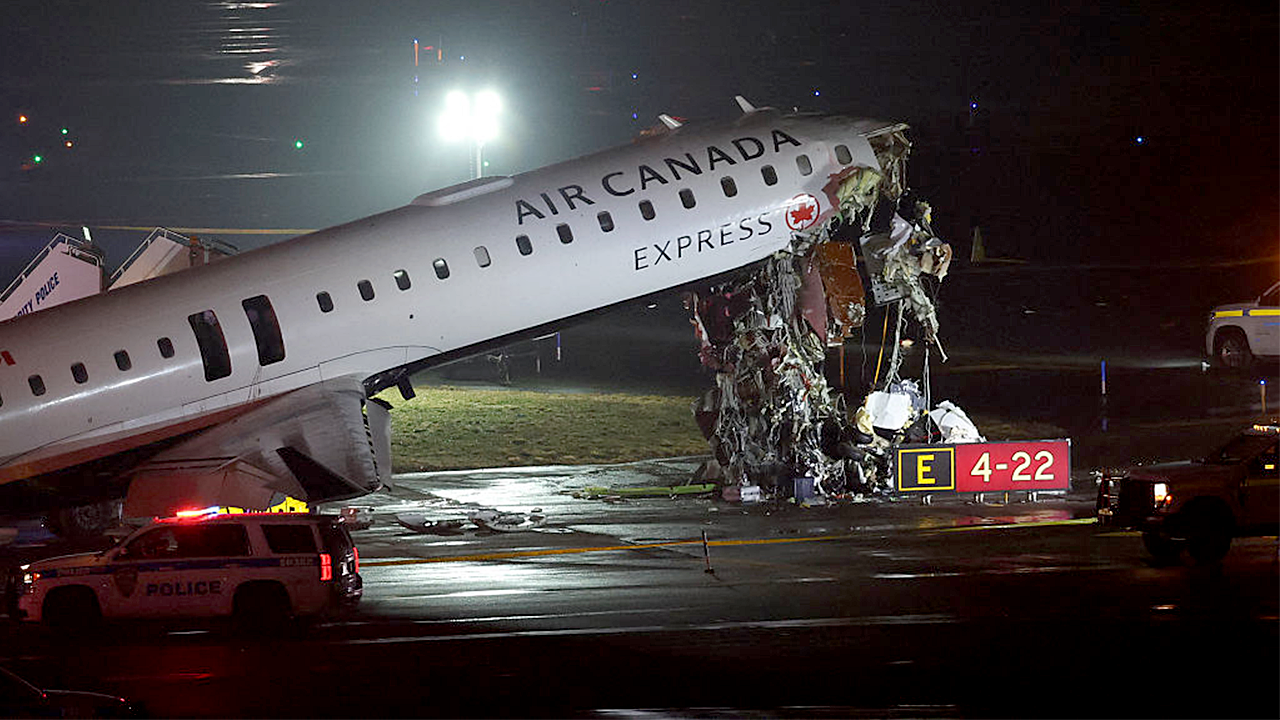 Air Canada jet hits fire truck, killing 2 and forcing New York’s LaGuardia airport to close