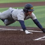 College baseball pitcher shoves runner on tag out, sparking benches to clear