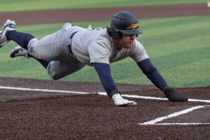 College baseball pitcher shoves runner on tag out, sparking benches to clear