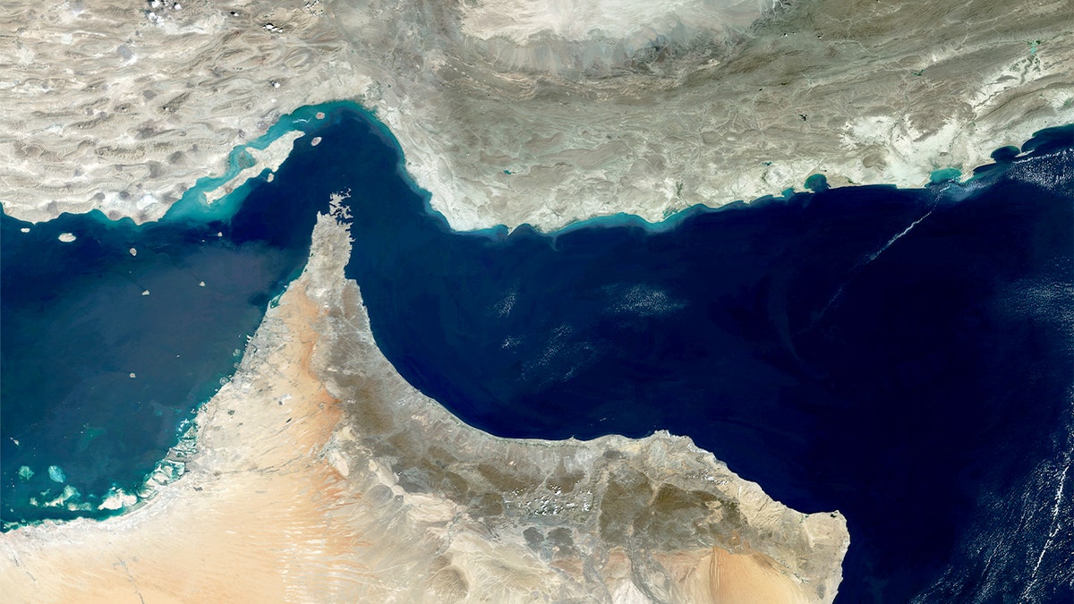 Satellite imagery shows a narrow maritime passage linking two large bodies of water.