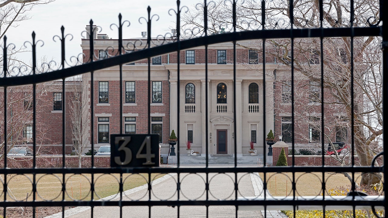 Police hunt armed suspect after housekeeper bound, attacked in luxury mansion heist: report