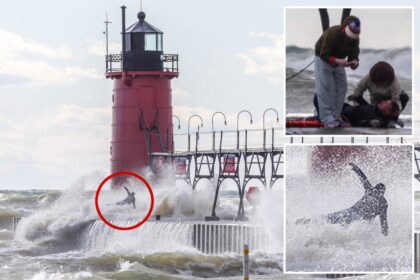 Heart-stopping photos show huge wave sweep man off Lake Michigan pier