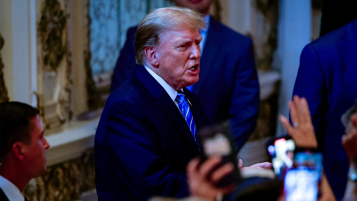 Trump speaks to a crowd at his Mar-a-Lago residence.