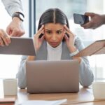 A staggering amount of burned-out workers say they’re doing 3 jobs at once — without a raise or promotion