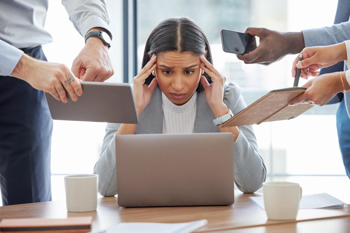 A staggering amount of burned-out workers say they’re doing 3 jobs at once — without a raise or promotion