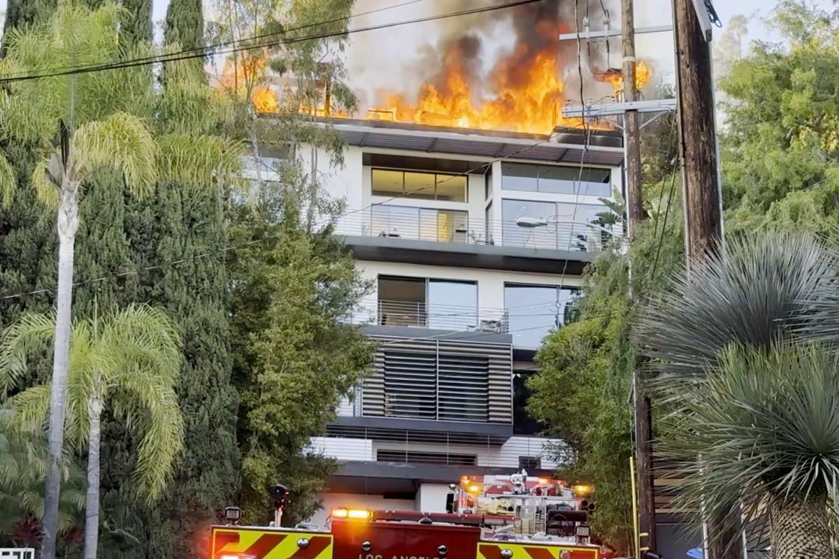 Inferno erupts at Hollywood Hills mansion as flames rip through roof