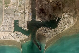 Fires rage at Iran’s Bandar Abbas naval headquarters, Strait of Hormuz traffic stalled
